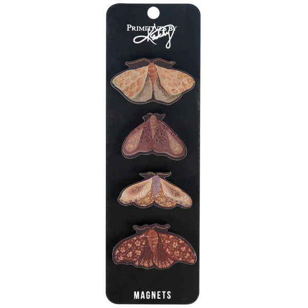 Set of four moth-shaped magnets on a black card with 'Primed by Katy' branding.