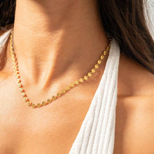 Load image into Gallery viewer, Gold necklace worn by a person with a white garment