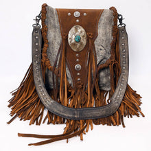 Load image into Gallery viewer, Brown leather handbag with fringe and decorative elements on a white background