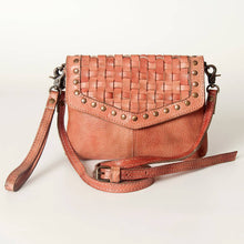 Load image into Gallery viewer, Brown woven leather crossbody bag with studded details on a light background