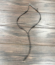 Load image into Gallery viewer, Necklace with beads on a wooden surface