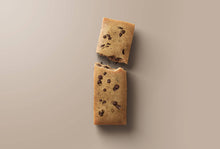 Load image into Gallery viewer, Two chocolate chip cookie bars on a beige background