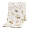 A folded fabric throw blanket with a light cream background and a printed autumn pattern featuring pumpkins, maple leaves, pinecones, acorns, and leaves in muted beige and brown tones.