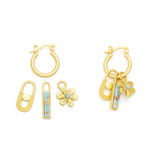 Load image into Gallery viewer, Set of gold hoop earrings with floral and geometric charms on a white background
