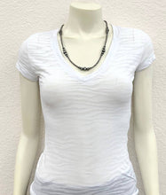Load image into Gallery viewer, White t-shirt on a mannequin with a necklace against a plain background