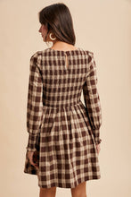 Load image into Gallery viewer, Woman wearing a brown and beige plaid dress against a beige background