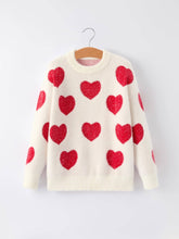 Load image into Gallery viewer, White sweater with red heart patterns on a hanger against a white background