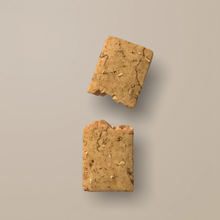 Load image into Gallery viewer, Two pieces of brown cookie on a beige background
