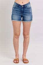 Load image into Gallery viewer, Person wearing blue denim shorts on a plain background