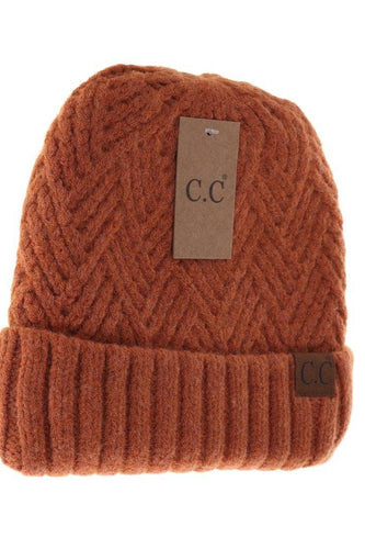 Brown knit beanie with 'cc' label on a white background
