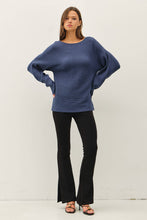 Load image into Gallery viewer, Woman wearing a blue sweater and black pants on a white background