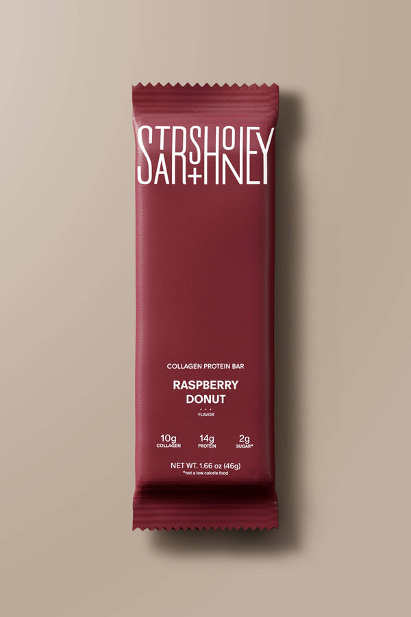 Maroon package of Stash Honey Raspberry Donut on a beige background