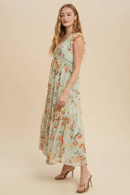 Load image into Gallery viewer, Woman wearing a floral dress on a beige background