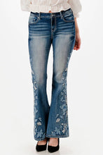 Load image into Gallery viewer, Flared jeans with floral embroidery on a white background