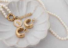Load image into Gallery viewer, Gold jewelry set with 'princess' necklace on a shell