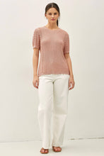 Load image into Gallery viewer, Woman wearing a pink blouse and white pants on a white background