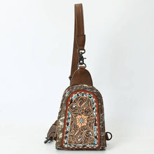 Load image into Gallery viewer, Brown leather sling bag with intricate designs on a white background