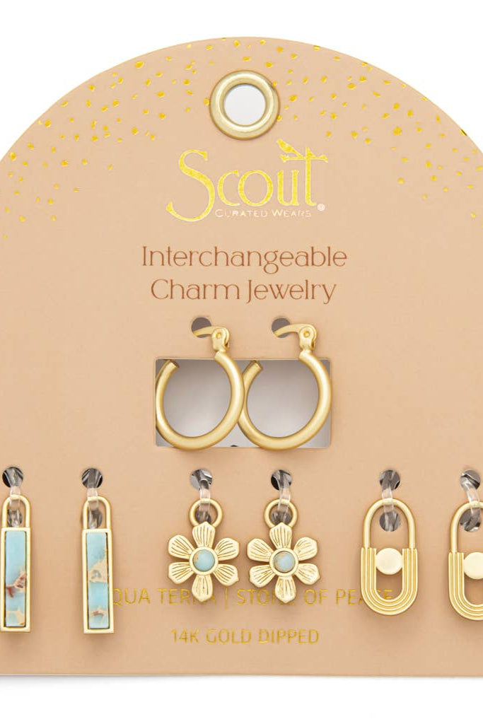 Scout interchangeable charm jewelry set on a beige card with gold accents.