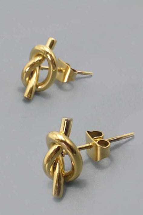 Gold knot-shaped earrings on a gray background with 'Stainless Steel Jewelry' text.