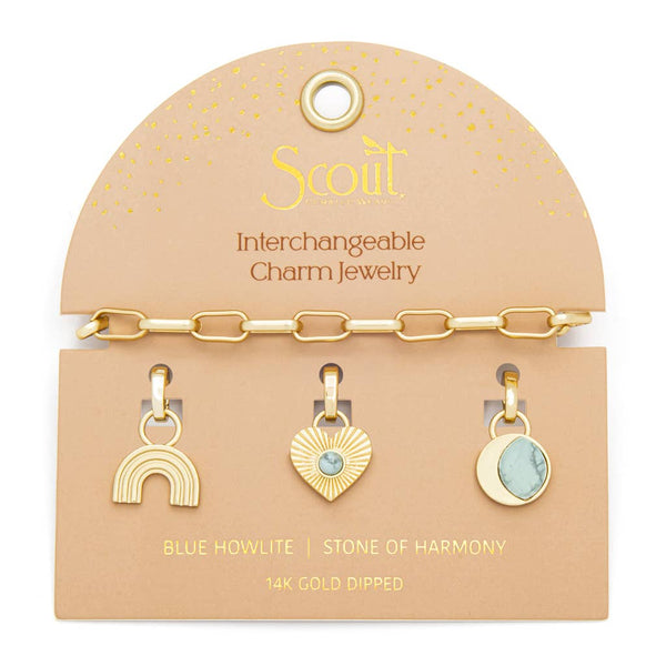 Scout interchangeable charm jewelry set on a beige card with gold chain and charms.