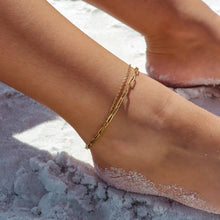 Load image into Gallery viewer, Gold anklet on a foot with sand in the background