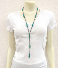 Load image into Gallery viewer, Turquoise beaded necklace on a mannequin wearing a white shirt against a plain background