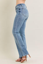 Load image into Gallery viewer, Light blue jeans worn by a person on a beige background