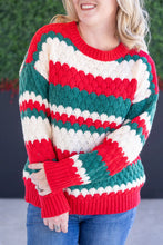 Load image into Gallery viewer, Woman wearing red green and white christmas sweater with a green ivy background