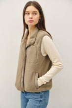 Load image into Gallery viewer, Woman wearing a beige fleece vest against a plain background