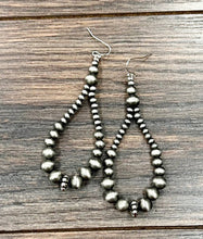 Load image into Gallery viewer, Pair of silver beaded earrings on a wooden surface