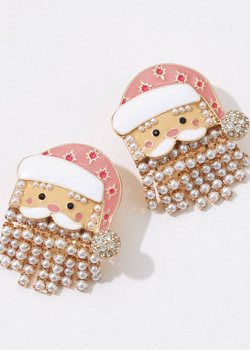 Santa Claus earrings with pearl details on a white background