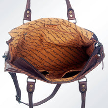 Load image into Gallery viewer, Brown leather handbag with visible text pattern on a white background