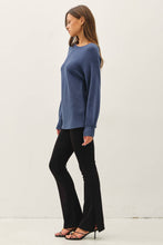 Load image into Gallery viewer, Woman wearing a blue sweater and black pants on a white background