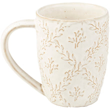 Load image into Gallery viewer, White ceramic mug with subtle leaf pattern on a white background
