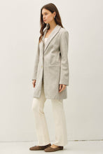 Load image into Gallery viewer, Woman wearing a light gray coat and white pants on a white background
