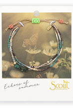 Load image into Gallery viewer, Multistrand beaded bracelet on Scout branded card with butterfly and floral background