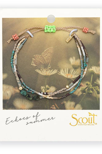 Multistrand beaded bracelet on Scout branded card with butterfly and floral background