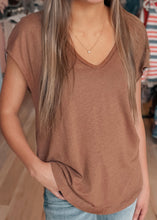 Load image into Gallery viewer, Person wearing a brown t-shirt with a blurred background