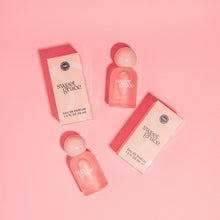 Load image into Gallery viewer, Two &#39;sweet grace&#39; perfume bottles and their packaging on a pink background