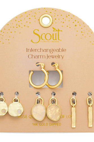 Gold interchangeable charm jewelry set on a Scout branded card