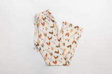 Load image into Gallery viewer, Folded pajama pants with chicken pattern on a white background