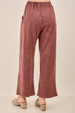 Load image into Gallery viewer, Mauve pants worn by a person on a beige background