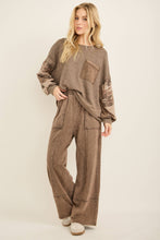 Load image into Gallery viewer, Woman wearing a brown outfit with a plain background