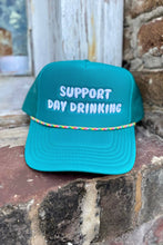 Load image into Gallery viewer, Teal cap with &#39;Support Day Drinking&#39; text on a stone surface