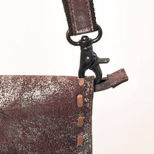 Load image into Gallery viewer, Close-up of a brown leather bag with a strap and clasp on a white background