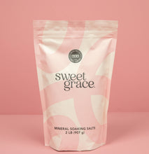 Load image into Gallery viewer, Bag of sweet grace mineral soaking salts on a pink background