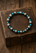 Load image into Gallery viewer, Bracelet with silver and turquoise beads on a wooden box
