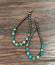 Load image into Gallery viewer, Beaded earrings with green and blue beads on a wooden surface