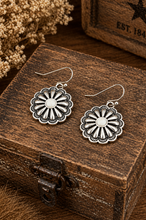 Load image into Gallery viewer, Silver floral earrings on a wooden box with dried flowers in the background