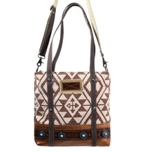 Load image into Gallery viewer, Handbag with geometric pattern and brown accents on a white background